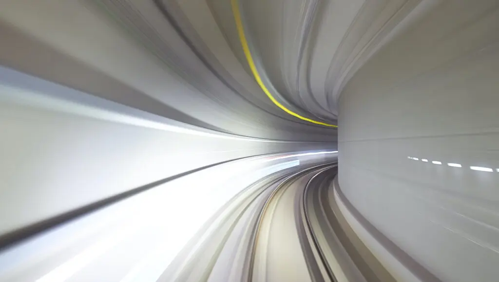 A futuristic tunnel curving to the right representing the leading edge (AI) of fundraising.