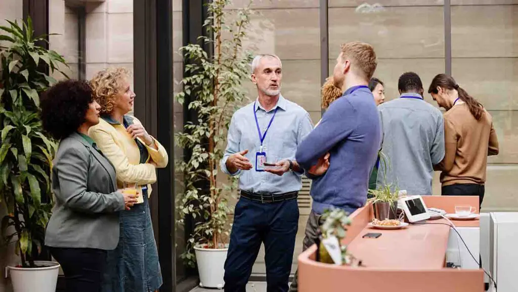 A head of school networks at a fundraising event for their school.