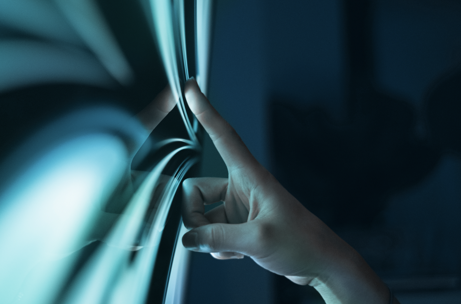 A picture of a finger touching a screen to unclock data insights.