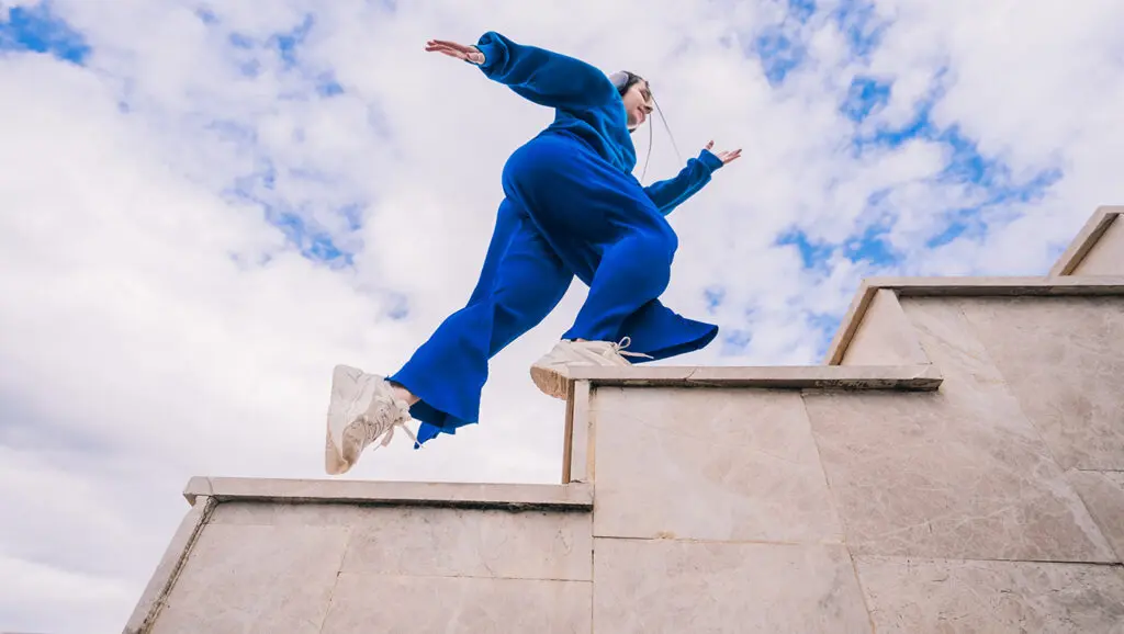 A person runs up stairs to illustrate reigniting a stalled fundraising campaign.