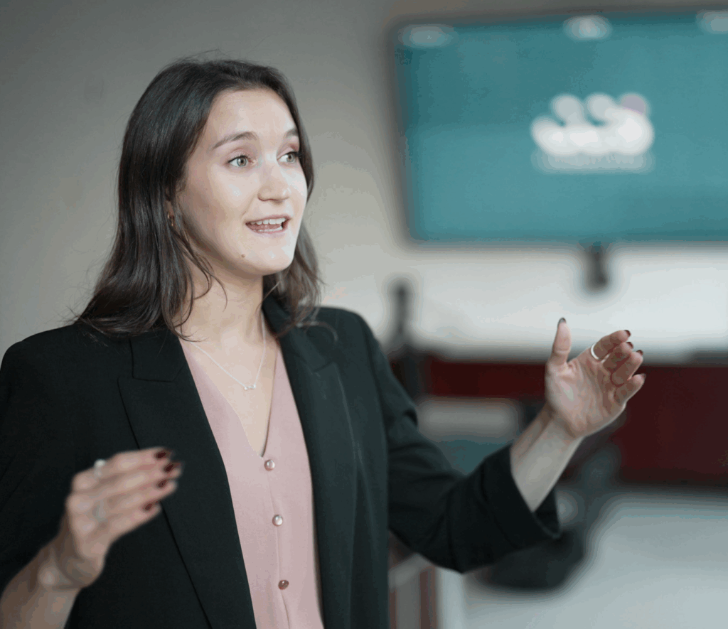 A CCS employee gestures while describing Seeker+