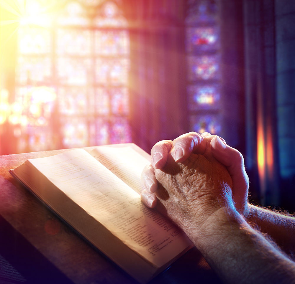 Person praying in a church