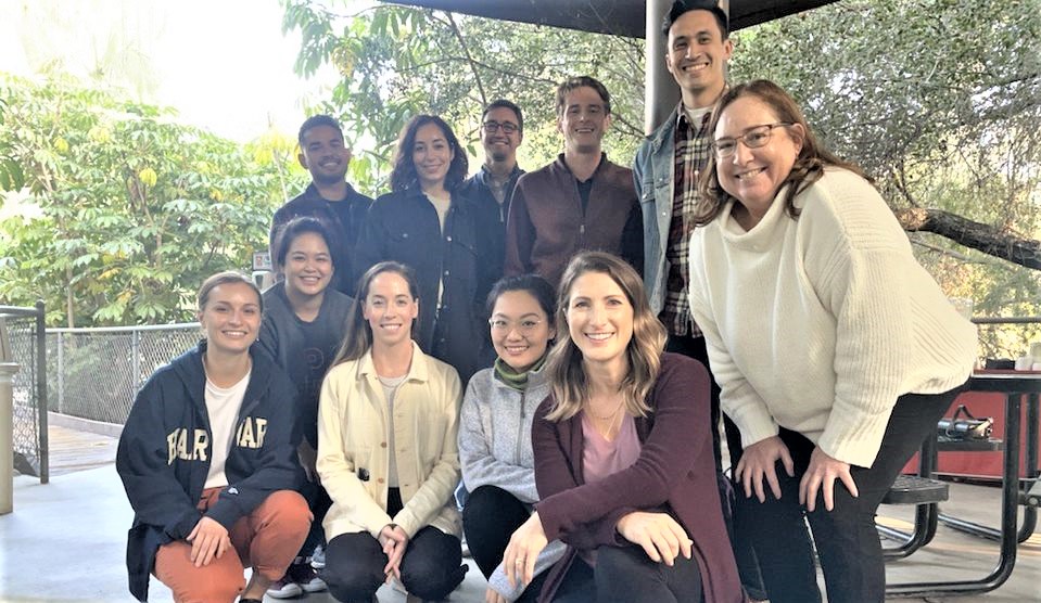 Members of a Western US CCS regional team pose together outside.