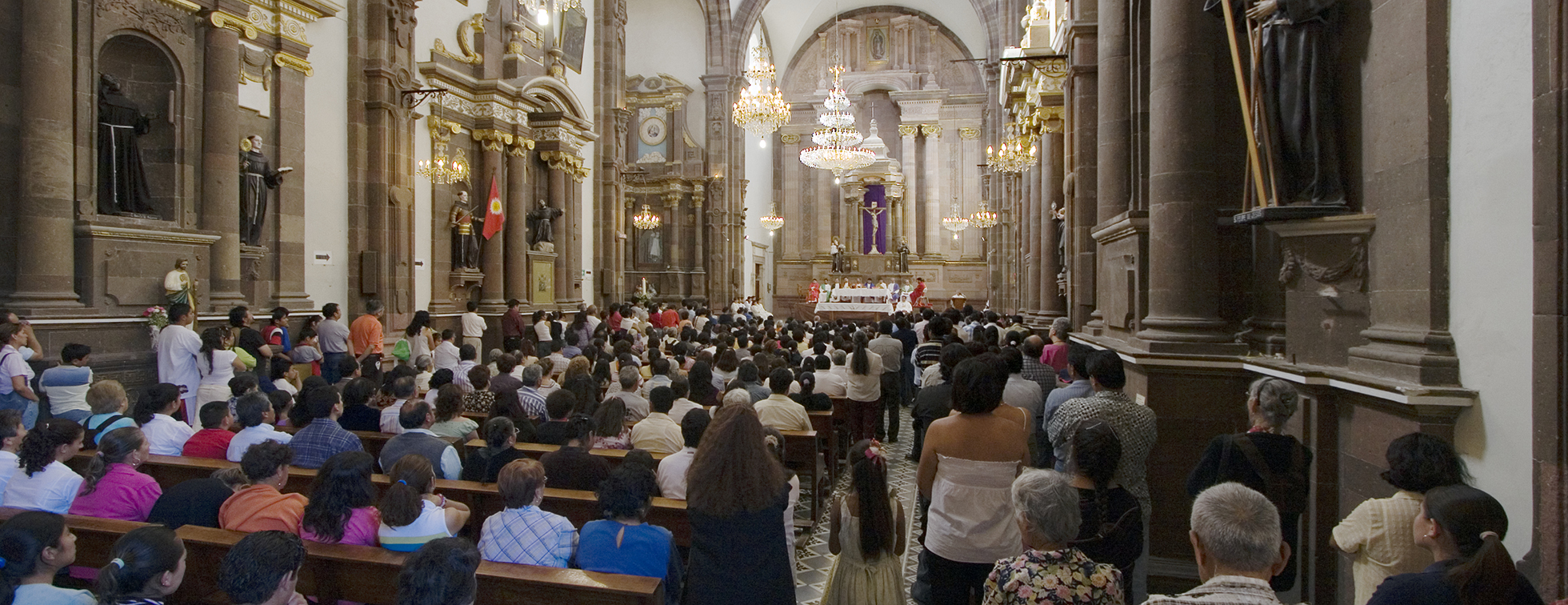 People attend a service at a Catholic church
