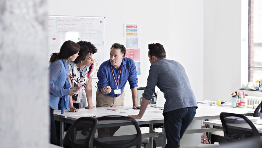 A picture of colleagues brainstorming in a development office at a higher education institution.