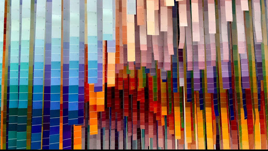 Long color swatches hanging down, representing the diverse identities that should be represented and included in data.