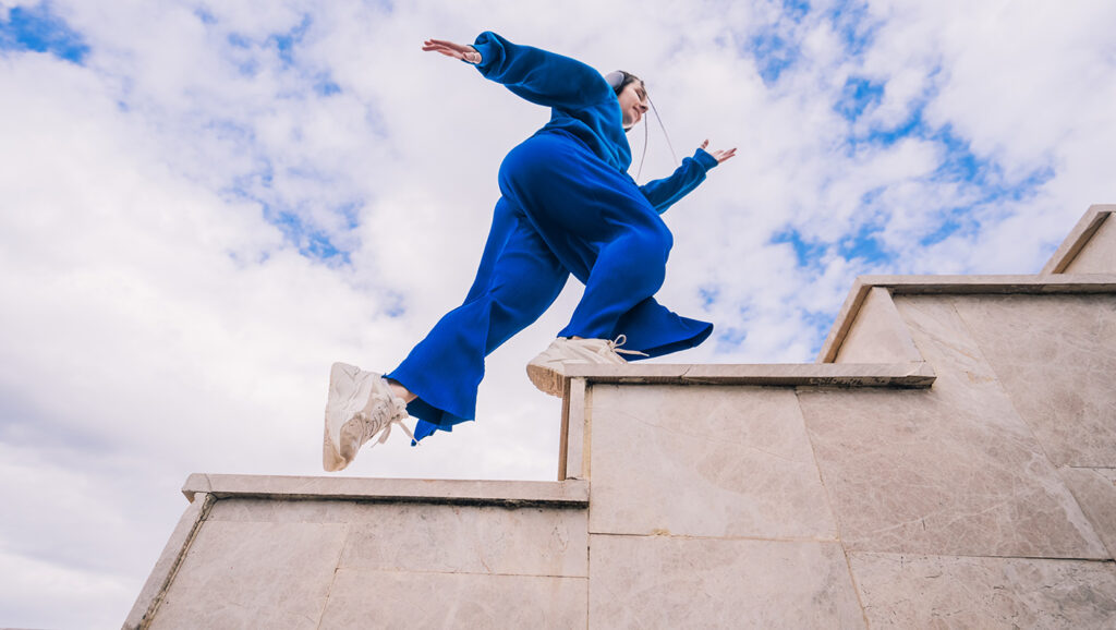 A person runs up stairs to illustrate reigniting a stalled fundraising campaign.