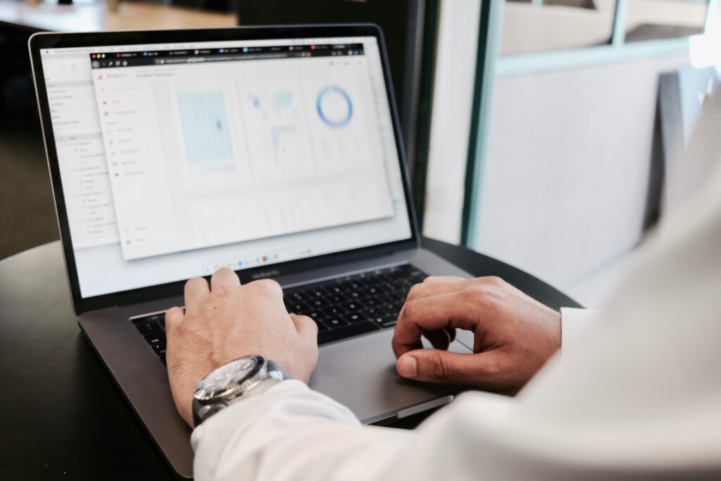 Business man's hands typing on laptop